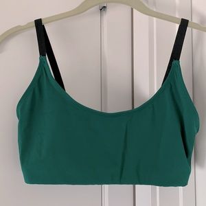 Green and black sports bra